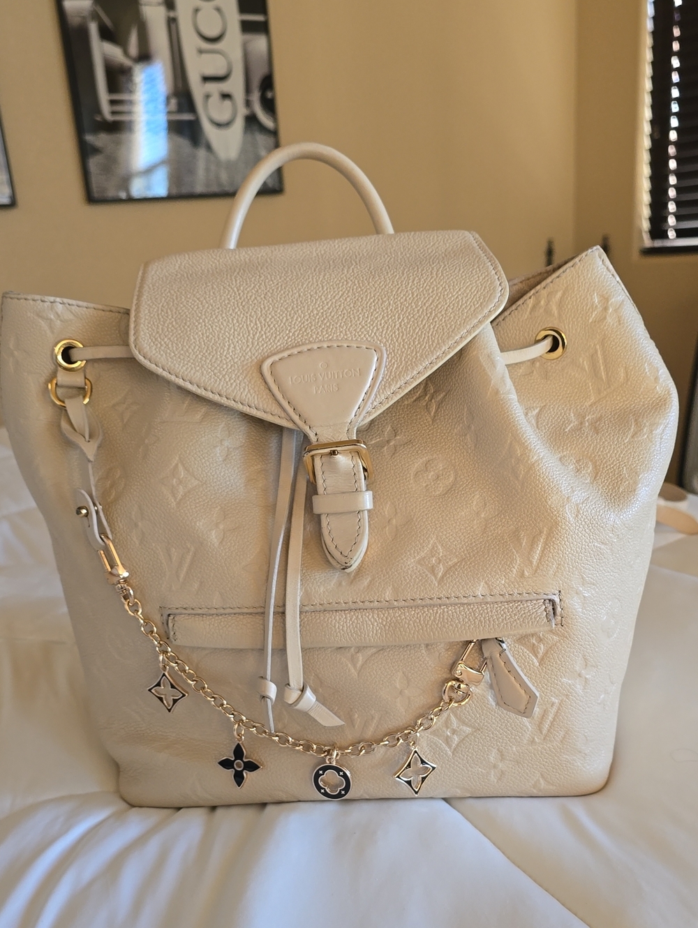 Louis Vuitton Cream Embossed Monogram Backpack with Gold Charm Chain